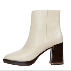 The Ruby Boot Features Signature Gold Gemini Link Chain A Nod To Tory’s Twins And Her Zodiac Sign Hand-Inlaid Into The Heel. Crafted In Smooth Leather, It’s Finished With A Chic Rounded Toe. 3.6" (90 Mm) Stacked Heel Leather Upper Color - Off White Elegant Platform Boots With Stacked Block Heel, Chic Boots With Padded Block Heel, Chic Ankle-high Platform Boots With 4-inch Heel, Chic Platform Boots With Sculpted Heel For Work, Chic Workwear Platform Boots With Sculpted Heel, Elegant Platform Boots With Reinforced Block Heel, Chic Leather Platform Boots With Block Heel, Elegant Platform Boots With Padded Heel, Chic Platform Boots With Stacked Heel For Office