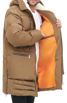 Stay warm in this heavyweight water-resistant parka constructed with a faux shearling–lined hood, roomy bellows pockets and side zip vents. 35" length Front zip closure Drawcord-toggle hood Chest zip pockets; front zip pockets; side-seam pockets; interior welt pocket Side zip vents Lined, with 100% polyester faux-shearling hood lining; 100% polyester fill 100% polyester Machine wash, tumble dry Imported Utility Parka With Multiple Pockets, Solid Parka With Multiple Pockets For Fall, Hooded Down Jacket With Pockets For Fall, Down Hooded Jacket With Pockets For Fall, Solid Fall Parka With Multiple Pockets, Fall Solid Color Parka With Multiple Pockets, Fall Down Hooded Jacket With Pockets, Khaki Puffer Jacket With Pockets For Cold Weather, Brown Parka With Pockets For Winter