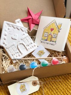 a box filled with different types of cookies and candies on top of a table