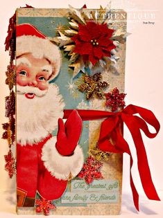 an old fashioned christmas card with santa clause holding a red ribbon and a poinsetti