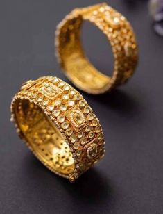 *This is Gold Finish Kundan Bangles Pair.Its Perfect for Wedding Occasion as well as Unique and Ethnic Traditional Bangle to gift and Also Bridal wear to match with Wedding Outfits. *Its made from Silver n Copper mix material and 100% Handmade. *Its available in Various Sizes like 2,2.2,2.4,2.6 Etc Its white kundan combination like shown in picture. *Its open able Screwed Bangles Pair. *All Kundan stones set with silver foils handsetting method and long last guarantee of its workmanship.It is Wh