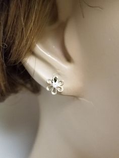 "Thanks for shopping our vintage estate store. We tend to sell well below wholesale and truly hope you enjoy all of our items. Many of the items are one of a kind, so please enjoy scrolling through the pictures and hopefully something will catch your eye. Brown spots are from camera. Nice estate 14k yellow gold .05ct cz diamond flower stud earrings. CZ's are nice and bright. Size: 6.5mm 1/4\" Weight: .33 gram Cz Diamonds: .05ct per stud Marked 14k and these are nice cz diamond studs. Backs are i Dainty Nickel-free Flower Earrings For Anniversary, Hypoallergenic Flower-shaped Earrings For Anniversary, Classic Flower Earrings With Prong Setting As Gift, Classic White Gold Flower Earrings For Anniversary, Classic Flower Earrings As Gift, Dainty Hypoallergenic Flower Earrings For Anniversary, Dainty White Gold Flower Earrings For Anniversary, Delicate Pierced Flower Earrings For Anniversary, Hypoallergenic Flower Shaped Earrings For Anniversary