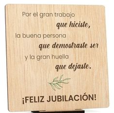 a wooden plaque with the words feliz jubilacion written in spanish