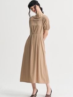 SORRY TOO MUCH LOVE is a brand that proposes romantic and unique clothing with the concepts of sweet, funky, and elegant.- Elegant and feminine mood long dress- Rayon fabric that flows gracefully with a soft touch- Various styling options with waist belts on both sides- Sleeve cuff banding and back logo print- Wide pleat details for a sophisticated and polished look Modest Brown Maxi Dress For Summer, Brown Modest Maxi Dress For Summer, Chic Pleated Brown Maxi Dress, Chic Brown Pleated Maxi Dress, Modest Brown Midi Dress, Brown Relaxed Fit Midi Dress For Spring, Chic Beige Dresses With Gathered Neckline, Chic Beige Dress With Gathered Neckline, Elegant Brown Maxi Dress For Daywear