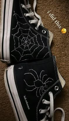 black and white shoes with spider web on them