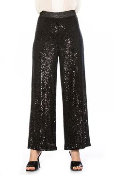 Sparkling sequins bring dazzling allure to a pair of stretch pants that are elevated by a wide leg and mid rise. Banded waist Invisible back zipper 90% polyester, 10% spandex; lining content: 100% polyester Hand wash cold, lay flat to dry Imported Model stats: 5'10", 32" bust, 25" waist, 36" hip. Model is wearing size X-Small. Stretch Embellished Bottoms For Evening, Embellished Stretch Bottoms For Evening, Glamorous Embellished Bottoms For Evening, Elegant Sparkling Bottoms For Evening, Glamorous Sequin Straight Leg Pants, Glamorous Straight Leg Sequin Pants, Embellished Stretch Pants For Evening, Embellished Straight Leg Bottoms For Night Out, Glamorous Embellished Evening Pants