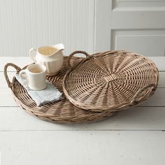 two wicker trays with coffee cups on them