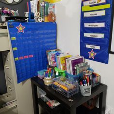 there is a desk with many school supplies on it in the room that includes pens, pencils and markers