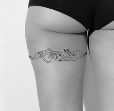 a woman's thigh with a line drawing of two hands holding each other on it