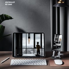 a computer monitor sitting on top of a wooden desk next to a keyboard and mouse