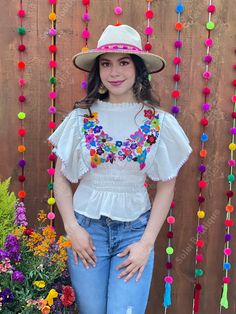 This beautiful Flounce Sleeve Top is the perfect Top for a fun day out or special event. The adorable fluttery sleeves and colorful hand embroidered flowers make it flirty and fun. It's made out of fine Mexican cotton, has an elastic waist and has colorful flowers embroidered completely by hand. This blouse is made with love by Mexican Artisans in Chiapas, Mexico. Please note: This blouse comes in one size which fits sizes Small and Medium. Purchase the Mexican hats here: https://www.etsy.com/es Spring Beach Peasant Top With Multicolor Embroidery, Summer Festival Embroidered Top With Boho Collar, Fitted Multicolor Embroidered Top For Festival, Hippie Blouse With Multicolor Embroidery For Spring, Spring Festival Multicolor Blouse, Spring Traditional Embroidered Fitted Top, Fitted Bohemian Embroidered Top For Vacation, Fitted Traditional Embroidered Top For Spring, Multicolor Peasant Top For Summer Festivals