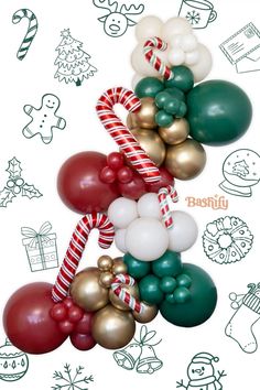 christmas balloons and candy canes are arranged on a white background