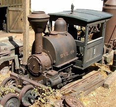 an old train is sitting on the tracks