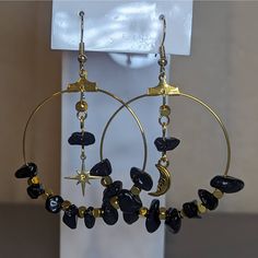 Mismatched Black And Gold Crystal Obsidian Chip Bead Moon And Star Hoop Earrings. Bead Size And Color May Vary Slightly As These Are Made To Order. Comes On Fish Hook Earrings. Black Dangle Hoop Earrings For Festivals, Black Celestial Earrings With Moon Charm, Black Moon Charm Celestial Earrings, Handmade Black Dangle Hoop Earrings, Black Celestial Dangle Earrings, Bohemian Black Metal Hoop Earrings, Handmade Black Hoop Earrings For Festival, Crystal Obsidian, Star Hoop Earrings