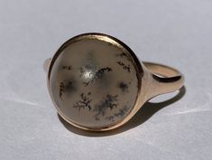 "Smart antique natural agate ring from the Victorian era in 14K gold. This lovely ring features a cabochon cut natural dendritic agate in a classic Victorian solid gold bezel setting. The gemstone is in excellent condition with a beautiful glow, and measures approximately 13..6mm. Held firmly in place in a sold gold bezel mount. Ring size 10 1/2 and easily sized up or down several sizes. All hallmarks carefully preserved during sizing or restoration.  Please allow one week for sizing. One month layaway payment plans on items $500 and over available. Approximate Age - Victorian Gemstone(s) - natural dendritic agate Metal - 14K solid gold  Weight - 4.1 grams Ring size - 10 1/2 Marks -  Makers Mark -  Comments -  Service & Sizing Information: If you require ring sizing or service, kindly foll Antique Engraved Cabochon Ring, Victorian Yellow Gold Cabochon Ring, Electroformed Brass Ring, Antique Brown Cabochon Ring, Antique 14k Gold Opal Ring, Oval Cabochon, Moss Agate Ring, Dendritic Agate, Agate Ring, Blue Quartz