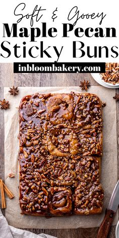 a close up of an apple pecan sticky buns on a piece of parchment paper