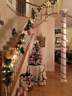 christmas decorations on the stairs in a house