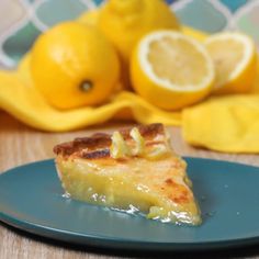 a piece of pie on a blue plate with lemons in the backgroud