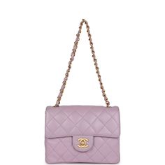 This Vintage Mini Square flap bag is of Light Purple Lambskin with matte gold hardware and has a front flap with signature CC turnlock closure, rear half moon pocket, and an interwoven purple leather and gold tone chain link shoulder/crossbody strap.The interior is lined in purple leather and features a zipper pocket with Chanel pull and an open pocket below.Collection: 6-Series (2000-2002)Origin: FranceCondition: Vintage; Excellent - This bag retains its shape with slight wrinkling, scratching Classic Purple Shoulder Bag, Classic Purple Formal Shoulder Bag, Classic Formal Purple Shoulder Bag, Luxury Purple Shoulder Bag With Gold-tone Hardware, Chanel Mini Square, Chanel Box, Chanel Mini, Bag Light, Purple Leather