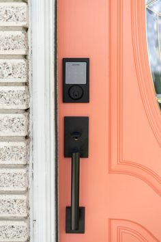 an orange door with a black lock on it