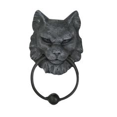 a black cat's head is mounted on a towel ring