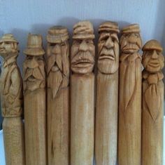 a group of carved wooden figures sitting next to each other