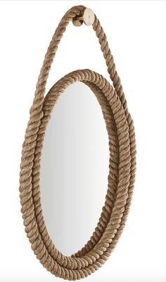 a rope mirror hanging on the wall