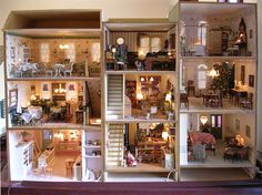 a doll house is shown with all the furniture and accessories in it's display case