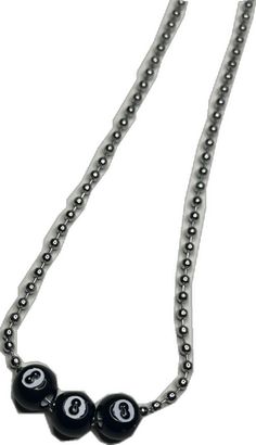 three black beads are attached to a chain