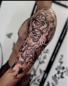 a man with a tattoo on his arm