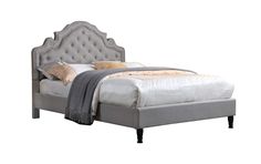 an upholstered bed with tufted headboard and foot board, made in grey linen