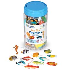 a canister filled with fish and sea creatures next to it's plastic lid