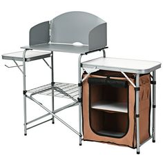 two folding chairs and a table with a shelf on the bottom one has a brown bag underneath it