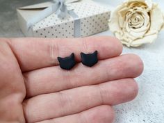 "These cute cat shaped studs are great for everyday wear. Simple and minimalist earrings for every cat lover out there. They can also be a great gift as they are displayed on beautiful earrings card with a quote: \"Love is a four legged word\". ➤LISTING INCLUDES: ➣ One PAIR of stud earrings ➣ Color: black, white or silver (choose from drop-down menu) ➣ Size: 10 mm ( approx. 0.4 inches). ➤MATERIAL: ☑ polymer clay ☑ Surgical steel or titanium posts (choose from a drop-down menu) ■ ■ We have combin Colorful Stud Earrings, Black Cat Earrings, Cat Earrings Studs, Gift Sets For Her, Cat Post, Jewelry Black, Earring Cards, Cat Lover Gift, Cat Earrings