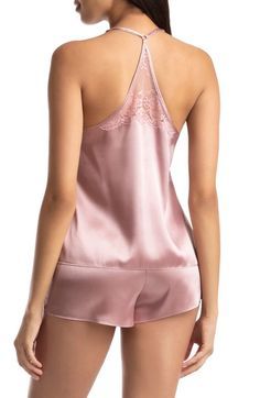 Fall in love completely with this satin cami and matching shorts featuring sheer lace with scalloped edges. 15 1/2" top center front length; 1 1/2" inseam, 26" leg opening; 9 1/2" front rise; 12 1/2" back rise (size Small) Cami has V-neck; adjustable straps; racerback Shorts have elastic waist 100% polyester with 64% nylon, 19% spandex, 17% rayon lace Machine wash, tumble dry Imported Lingerie Sleeveless Lace Closure Camisole For Summer, Summer Camisole With Lace Closure, Sleeveless Summer Camisole With Lace Closure, Summer Sleeveless Camisole With Lace Closure, Summer Lace Closure Camisole, Lace Trim Camisole For Pajama Party, Satin Camisole For Bedtime, Lace Trim Camisole With Spaghetti Straps For Pajama Party, Lace Camisole With Lace Trim For Pajama Party