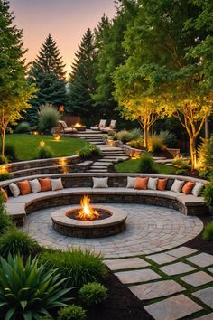 an outdoor fire pit surrounded by landscaping