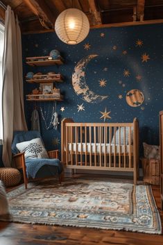 a baby's room decorated in blue and gold with stars on the wall, crib, rocking chair, and rug