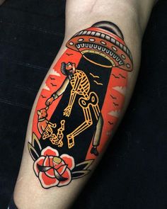 a person with a tattoo on their arm has a black and red design on it