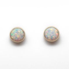 These opal stud earrings are beautiful.  They feature a single 6mm simulated opal cabochons.  Hand bezel set in my studio.  • 6mm Simulated Opal Round Cabochons• 14k Gold Filled or 925 Sterling SilverThey will arrive carefully packaged in a signature kraft gift box. Check out all of my opal earrings: https://www.etsy.com/shop/KMBankston/search?search_query=opal+earring&order=date_desc&view_type=gallery&ref=shop_search~About Me:My name is Kathy Bankston, and I am a metalsmith and lampwork bead ma Opal Earring, Opal Stud Earrings, Opal Earrings Stud, Opal Studs, Opal Earrings, Seed Bead Jewelry, Opal Jewelry, Post Earrings, Gold Filled