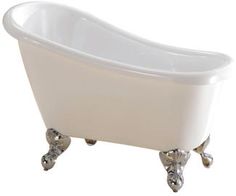 a white bath tub sitting on top of a metal stand