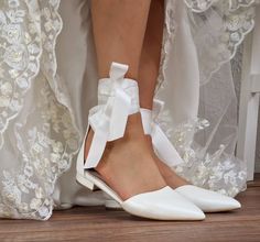 Soft white wedding ballet flats with long satin ribbons and ankle straps.  Our shoes are entirely handmade by us. Our shoes have our brand signature PELINO written on the inside of the shoes ★★ Shoe size may vary depending on your foot shape and width. If you are not sure about your size, or you are exactly on the limit of two sizes, consult us. We would like to help you choose the right size. Full sizes only ★ If you are unsure of your size, please contact me so I can assist you. Plain ankle st Wedding Ballet Flats With Bow And Closed Toe, Wedding Ballet Flats With Satin Bow, Wedding Closed Toe Ballet Flats With Satin Bow, Elegant Wedding Ballet Flats With Satin Bow, Closed Toe Wedding Shoes With Ribbon, Wedding Shoes With Ribbon And Ankle Strap, Ankle Strap Wedding Shoes With Ribbon, Bridal Shoes Lace, Strappy Wedding Shoes