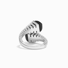 a white and black ring with diamonds in it's center on a white background