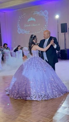 a man and woman dancing on a dance floor