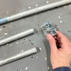 a person is working on some metal parts