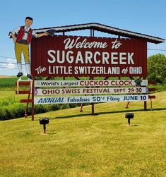 there is a sign that says welcome to sugarcreck the little switzerland and ohio