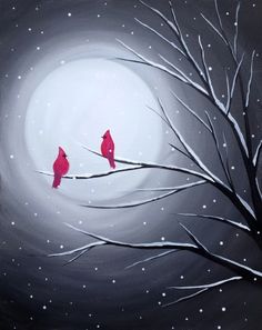 two red birds sitting on a tree branch in front of a full moon