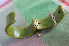 "Fantastic Bakelite bracelet. In very good vintage condition, small chip in the bakelite as seen in photos on the side of the bracelet. Inside diameter measures 2 1/4\" opening. Bakelite is 1 3/16\" wide. Hinge and clasp work well. This is a real statement piece. From a smoke free home. Thank you for looking, Sue" Bakelite Bracelets, Olympia, Bangle Bracelet, Statement Pieces, Cuff Bracelets, Bangle Bracelets, Vintage Jewelry, Jewelry Bracelets, Bangles