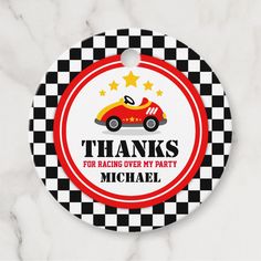 a red and black checkered label with the words thanks for racing over my party