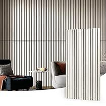 a living room filled with furniture and walls covered in vertical striped wall coverings next to a window