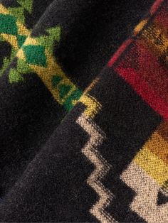 Pendleton looks to historic physical locations for design inspiration. This wool scarf is jacquard-knitted with its 'Four Corners' motif, referencing the only point in America that's shared by four states (it also marks the boundary of the Navajo Nation and Ute Mountain Ute Tribe Reservation). Black Wool Jacquard Knit Outerwear, Black Jacquard Winter Outerwear, Black Jacquard Outerwear For Winter, Scarf For Men, Navajo Nation, Summer Sunglasses, Scarf Men, Jacquard Knit, Fine Jewelry Designers